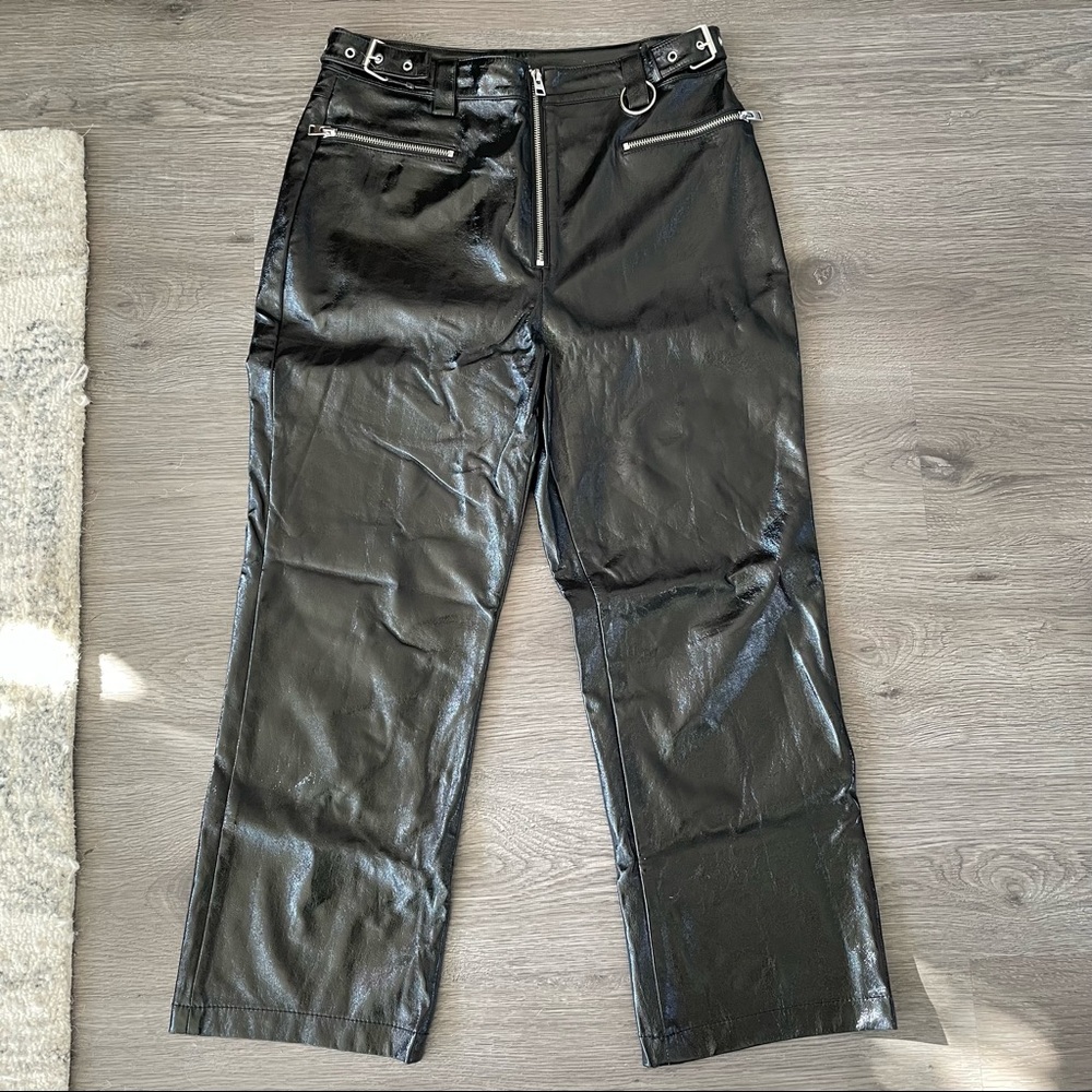 Black leather pants with metal detailing